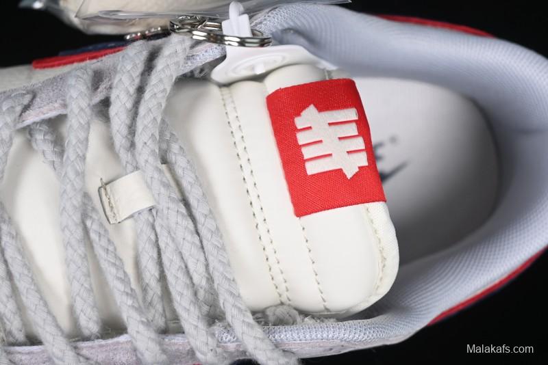 Nike SB Dunk Low UN Collaboration Anniversary Edition Custom Lifestyle Sneakers with Black Swoosh and Gum Sole - DM6868-032